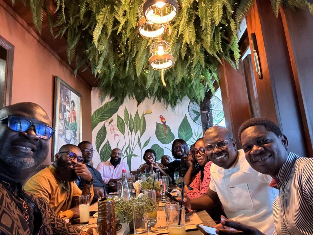 Colleagues sharing a long table over lunch